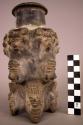 Ceramic vase, moulded, incised & applique human figures & facial features