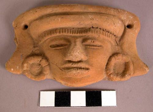 Ceramic ornament, moulded, incised, perforated human head