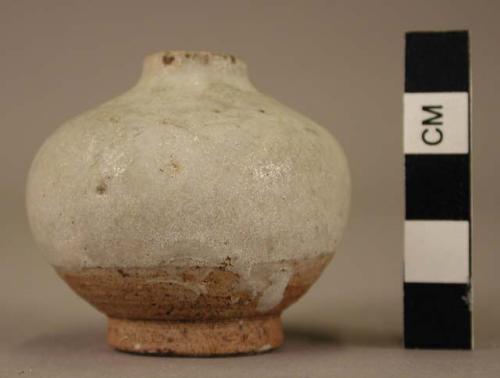 Small white jar with very small neck & mouth