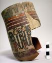 Vase and sherds; painted in polychrome with marine? creatures, steps, red bands