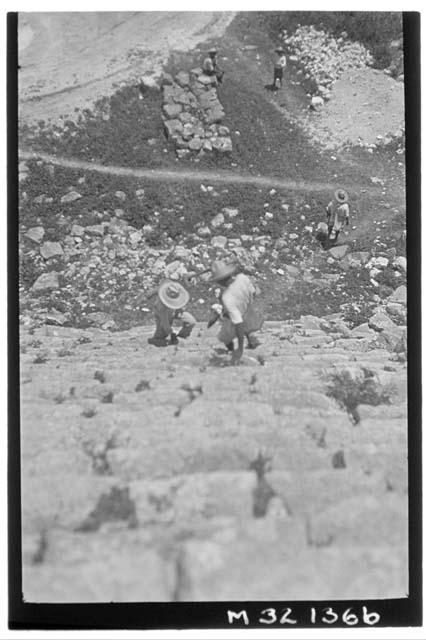 Workmen descending stairs at Monjas