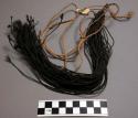 Woman's "tail"-bustle, bunch of black fibre string