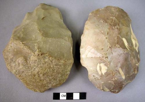 2 heavilly rolled handaxes- one large flake implement worked on upper surface