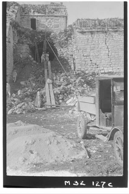 Cave repair at Monjas with Ford truck hoisting capstones.