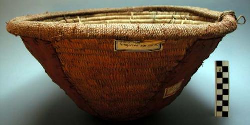 Grain basket of vine filler rings covered and woven with palmetto