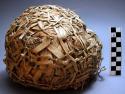 Boy's foot ball made of leaves. Mpira - rubber in Swahili