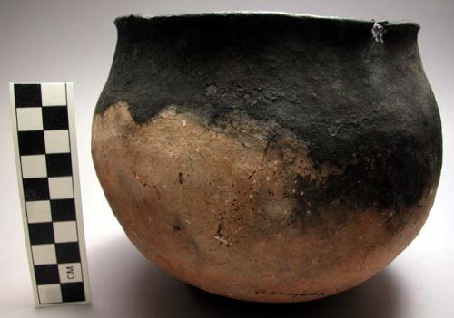 Small clay pot made by tonga women, used to carry and hold water