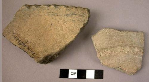 2 potsherds - indented decorated grey ware