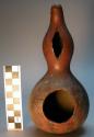 Gourd vessel with hole on one side.  Urubaku