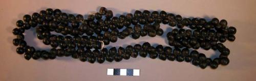 Object made of black seeds (called chifiririma) and used as belt by +