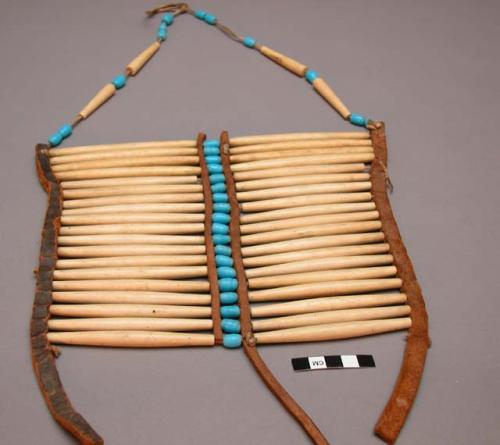 Breast plate - bone and bead decoration