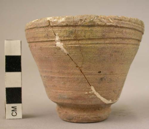 Small triangular shaped pottery vessel