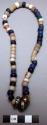 Necklace, blue, white and pink beads, small iron rings, olunigi lwomukala