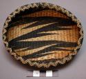 Basket, oval body, lipped rim, woven dark & natural zig-zag designs