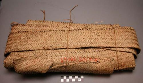 Grain bag nearing completion - representing one stage in weaving process (cf. 50