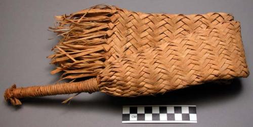 Beer maker made of woven palm leaves