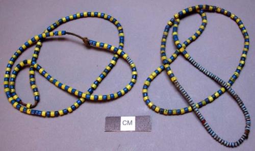 Necklaces, blue & yellow glass beads on knotted string