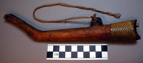 Wooden war and (now) dancing horn - ornamented with fish skin