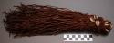Nubian boy's dress, consists of many leather strings attached to thin, braided w
