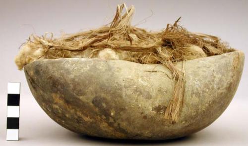 Gourd bowl filled with raw cotton & plant fibers