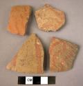 4 potsherds - "brittle orange"  buff ware with wavy vertical lines painted in re