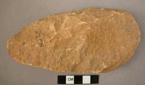 Quartzite cleaver with "V" shaped butt, and convex cutting edge