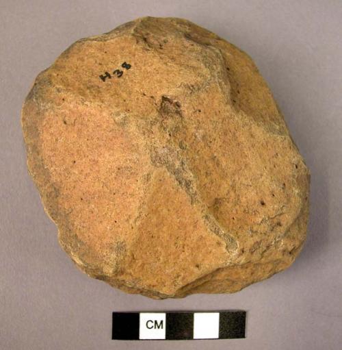 Discoidal quartzite hand axe, heavily rolled