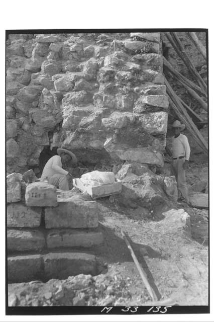 Base of stairs showing cave beneath crack at Monjas