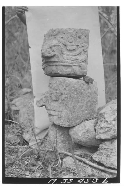 Single stone mask in wall at west end of south line at Monjas.