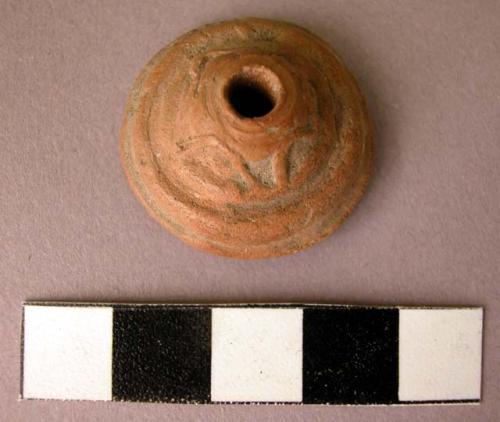 Ceramic spindle whorl with incised decoration