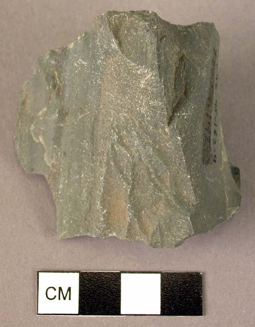 Stone, chipped stone implement, grey, wedged-shaped, sharp edges