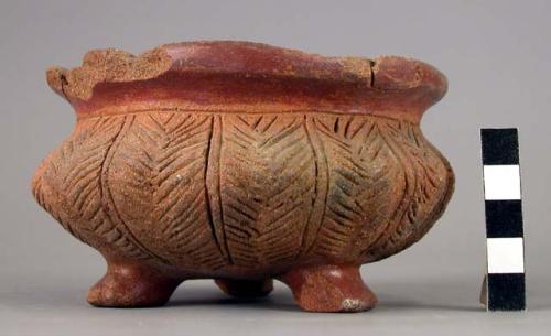 Medium sized tripod pottery bowl with short legs -scariffied