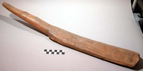 Wooden earth beater to harden clay floors of newly built huts