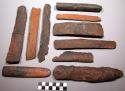 Unclassified tools; fragments of carved wood &  of curved bark; burnt