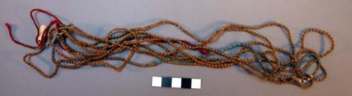 Women's necklace of beads and saradango seeds