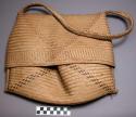 Palmetto covered basket made by men