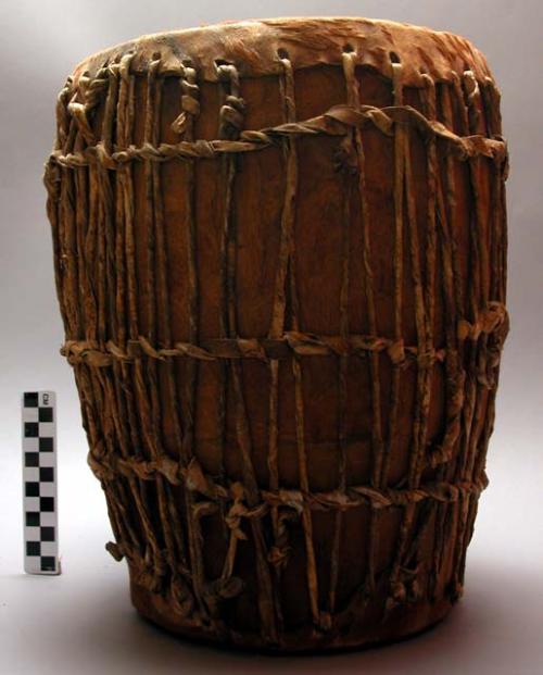 Double-headed drum, wooden with hide ends and thong lacings