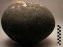 Globular pot, textile (?) marked