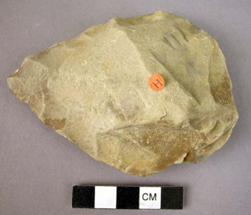 Fine-pointed quartzite hand axe, chipped all around to form an edge