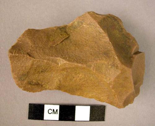 Small, crude, irregular, quartzite hand axe made from flake