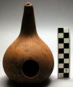 Gourd vessel with hole on side. Luwoko