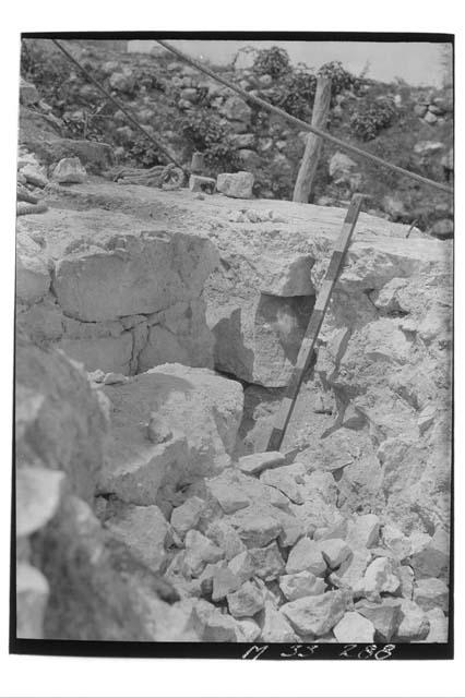 Monjas, Platform 3, southwest corner main stairs showing crack and break in corn