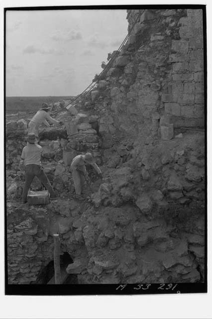 Preparing new foundation and west casing of second story stairs at Monjas.