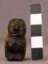 Small stone figurine.