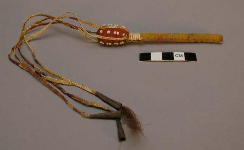 Baton-shaped object ornamented with quills and bead work