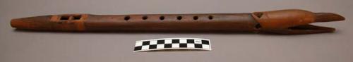 Teton Sioux carved flute. Split piece of wood hollowed out and put back together