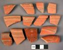 Ceramic rim sherds, fine red ware, incised and molded design