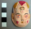 Miniature plaster mask - human face, natural color, small face on +