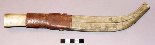 Knife and scabbard. knife has a bone handle with heavy metal blade. Scabbard is