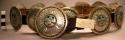 Leather belt with a round concha buckle with an overlaid sun-god design inlaid i